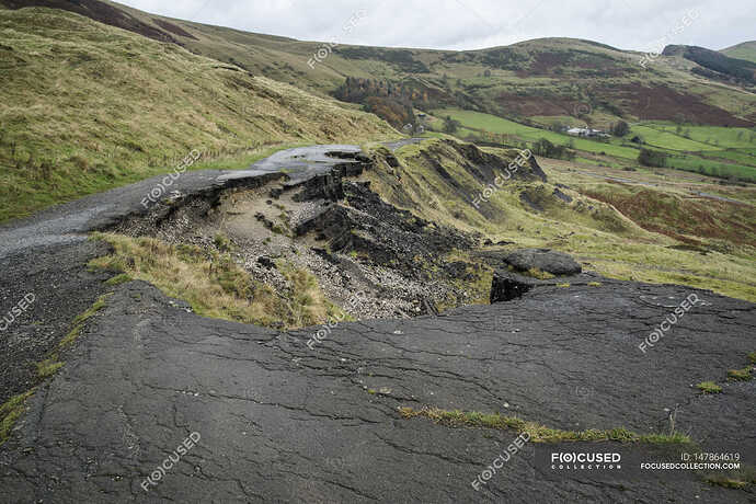 focused_147864619-stock-photo-collapsed-a625-road-in-peak